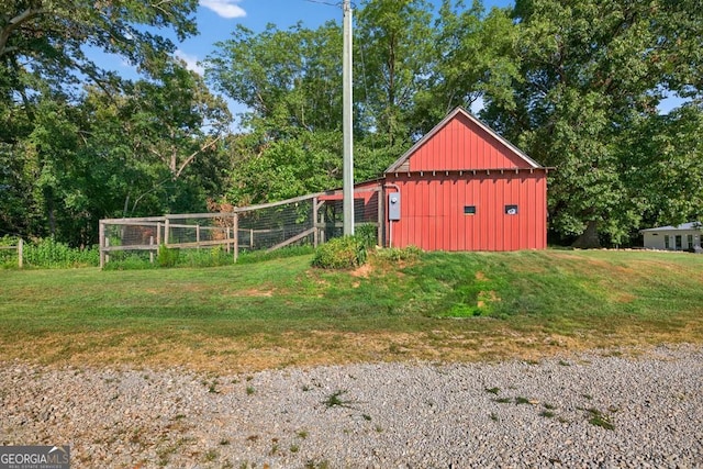 1724 Cedar Grove Church Rd, Winder, GA 30680 - view of home's exterior with board and batten siding, a yard, and an outdoor structure