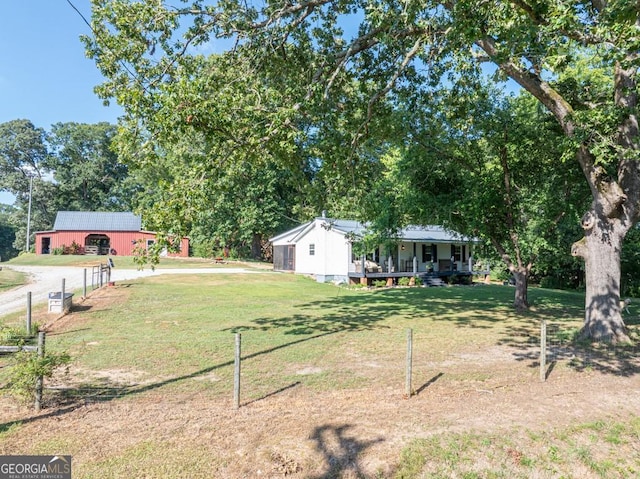 1724 Cedar Grove Church Rd, Winder, GA 30680 - view of grassy yard with a porch and an outdoor structure