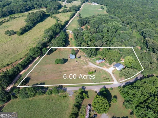 1724 Cedar Grove Church Rd, Winder, GA 30680 - aerial view of property's location with property boundaries highlighted and a heavily wooded area