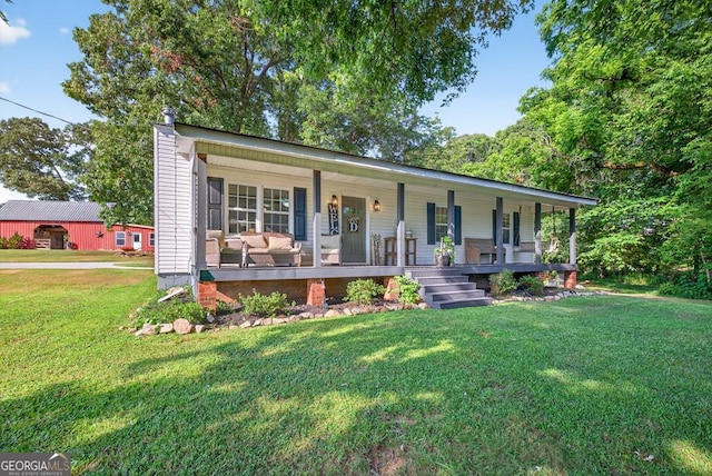 1724 Cedar Grove Church Rd, Winder, GA 30680 - view of front of house with a porch, a front lawn, and a chimney