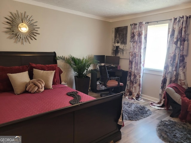 1625 Conley Rd Unit 229, Conley, GA 30288 - bedroom with wood finished floors, ornamental molding, an office area, and a textured ceiling