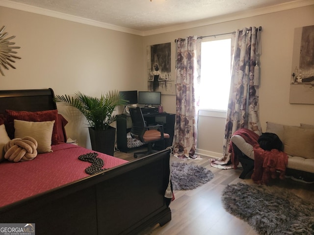 1625 Conley Rd Unit 229, Conley, GA 30288 - bedroom featuring wood finished floors, crown molding, a desk, and a textured ceiling
