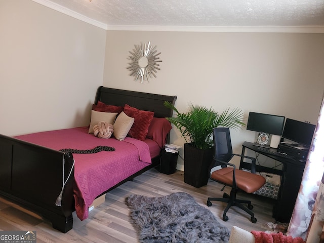1625 Conley Rd Unit 229, Conley, GA 30288 - bedroom with wood finished floors, crown molding, and a textured ceiling