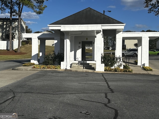 1625 Conley Rd Unit 229, Conley, GA 30288 - view of front of house featuring stucco siding and a carport