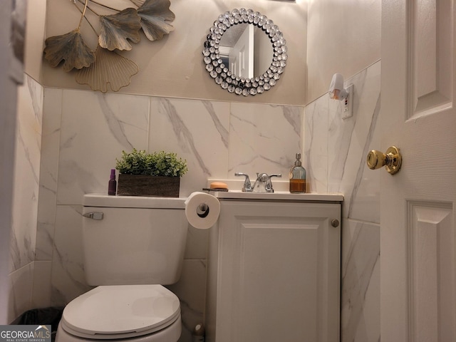 1625 Conley Rd Unit 229, Conley, GA 30288 - half bathroom featuring vanity and tile walls