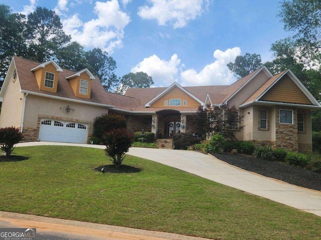 601 Sawgrass Walk, Mcdonough, GA 30253 - craftsman-style home featuring concrete driveway, stone siding, a front lawn, stucco siding, and an attached garage