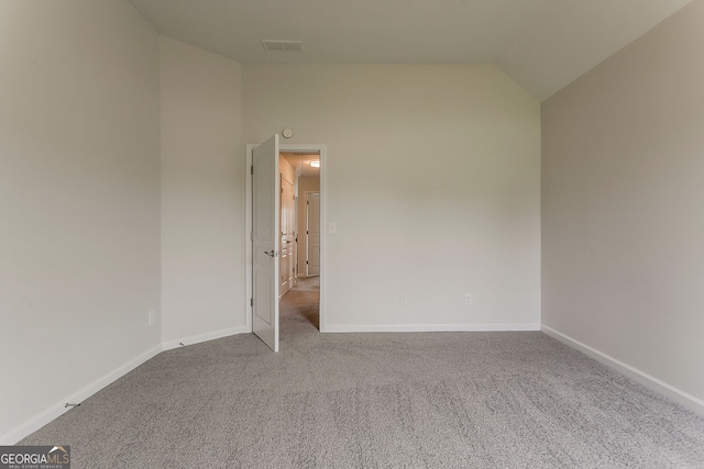 70 Trinity Ln, Covington, GA 30016 - carpeted spare room featuring vaulted ceiling and baseboards