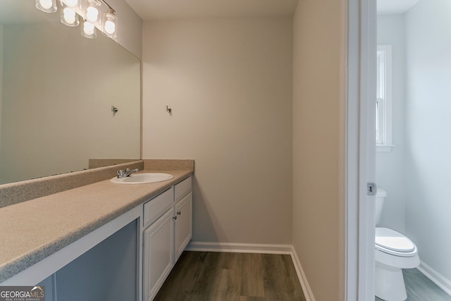 70 Trinity Ln, Covington, GA 30016 - bathroom featuring vanity and wood finished floors