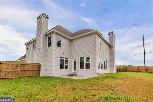 70 Trinity Ln, Covington, GA 30016 - back of house featuring a chimney, a patio area, and a fenced backyard