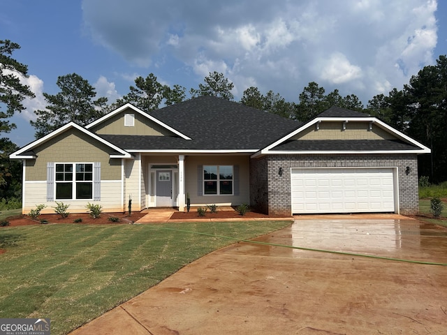 1179 Barrington Place Way, Macon, GA 31220 - craftsman-style home with driveway, a front lawn, a garage, brick siding, and a shingled roof