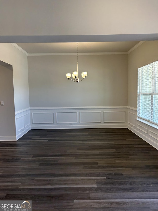 1179 Barrington Place Way, Macon, GA 31220 - unfurnished dining area with ornamental molding, a chandelier, dark wood-type flooring, a decorative wall, and wainscoting