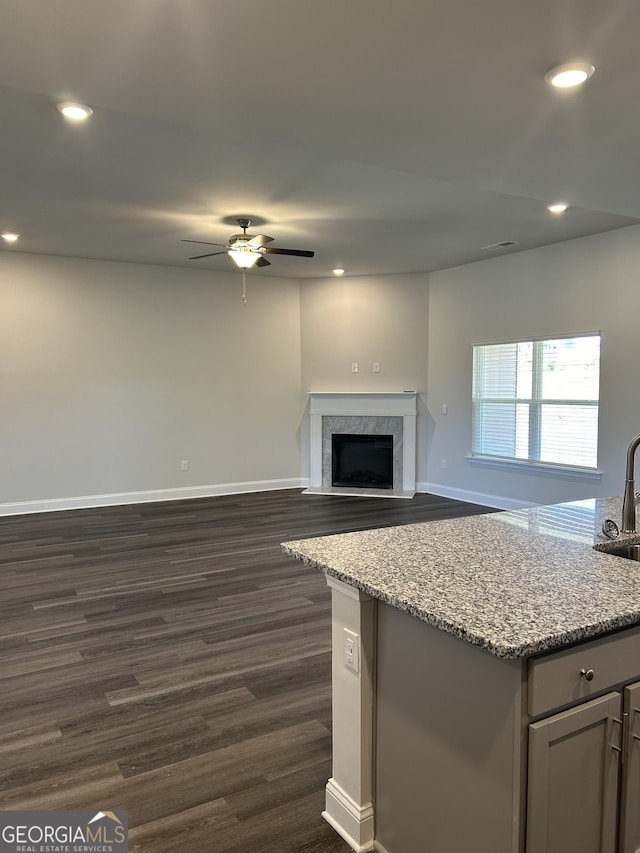 1179 Barrington Place Way, Macon, GA 31220 - unfurnished living room with a ceiling fan, dark wood-style floors, recessed lighting, and a fireplace