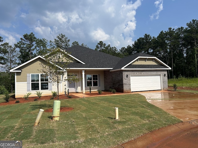 1179 Barrington Place Way, Macon, GA 31220 - view of front of home featuring a front yard, a garage, concrete driveway, a porch, and brick siding