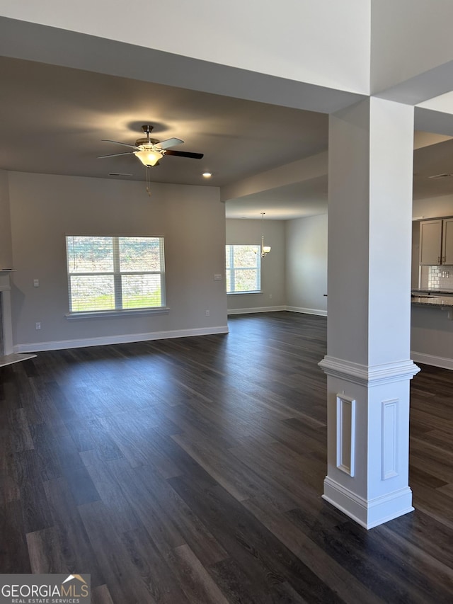 1179 Barrington Place Way, Macon, GA 31220 - unfurnished living room with ceiling fan, dark wood-type flooring, a chandelier, recessed lighting, and a glass covered fireplace