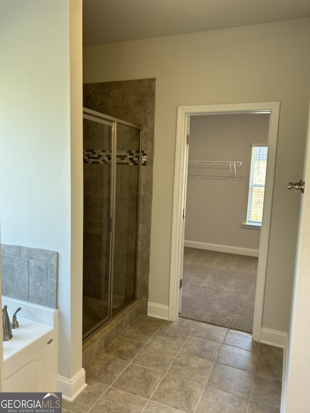 1179 Barrington Place Way, Macon, GA 31220 - full bathroom featuring a shower stall, a garden tub, a spacious closet, and tile patterned floors