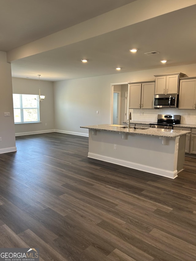 1179 Barrington Place Way, Macon, GA 31220 - kitchen featuring stainless steel appliances, a chandelier, recessed lighting, backsplash, and dark wood-type flooring