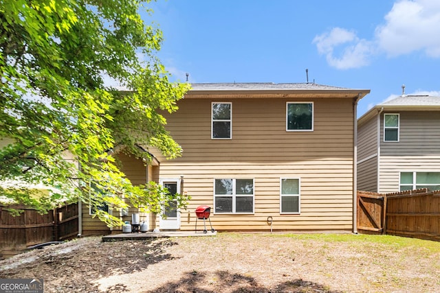 94 Torero Trl, Newnan, GA 30263 - rear view of house with a fenced backyard