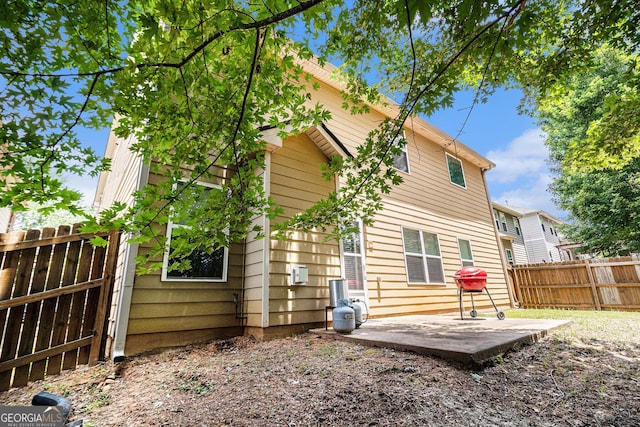 94 Torero Trl, Newnan, GA 30263 - rear view of house featuring a patio area and a fenced backyard