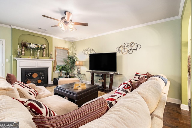 94 Torero Trl, Newnan, GA 30263 - living area with ceiling fan, wood finished floors, ornamental molding, and a fireplace with flush hearth
