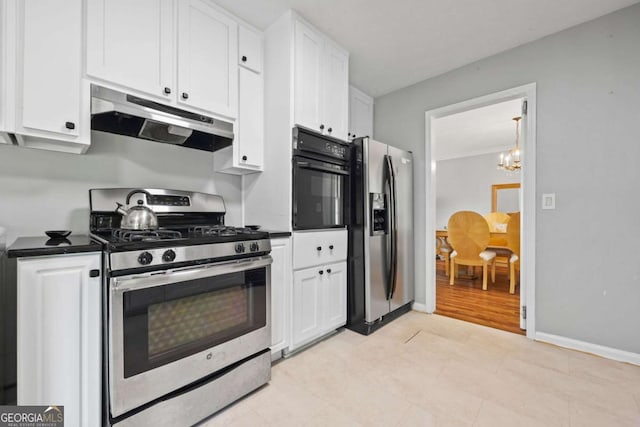 1809 Claron Ave, Conley, GA 30288 - kitchen with stainless steel appliances, extractor fan, and white cabinetry