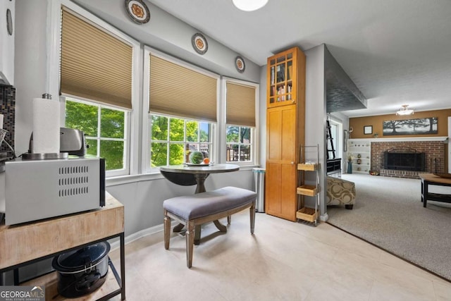 1809 Claron Ave, Conley, GA 30288 - living area featuring a fireplace and light colored carpet
