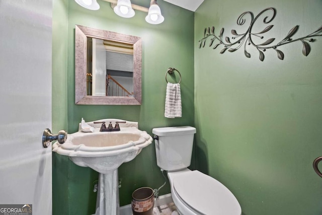 1809 Claron Ave, Conley, GA 30288 - half bathroom featuring toilet and baseboards