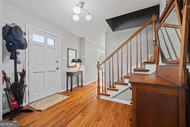 1809 Claron Ave, Conley, GA 30288 - entryway with hardwood / wood-style floors, stairs, and a textured ceiling