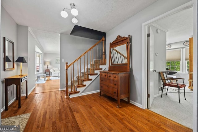 1809 Claron Ave, Conley, GA 30288 - stairs with wood finished floors and a textured ceiling