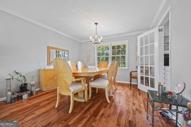 1809 Claron Ave, Conley, GA 30288 - dining room featuring a chandelier, wood finished floors, and ornamental molding