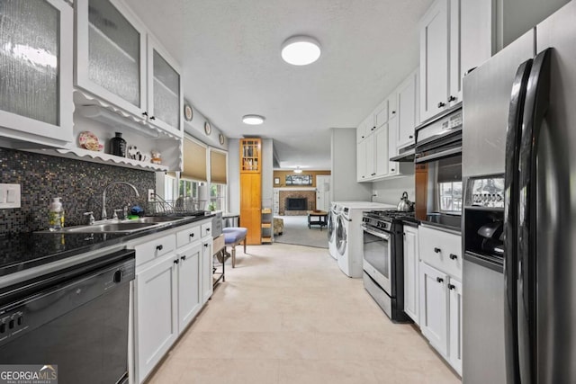 1809 Claron Ave, Conley, GA 30288 - kitchen with black appliances, white cabinets, dark countertops, and tasteful backsplash