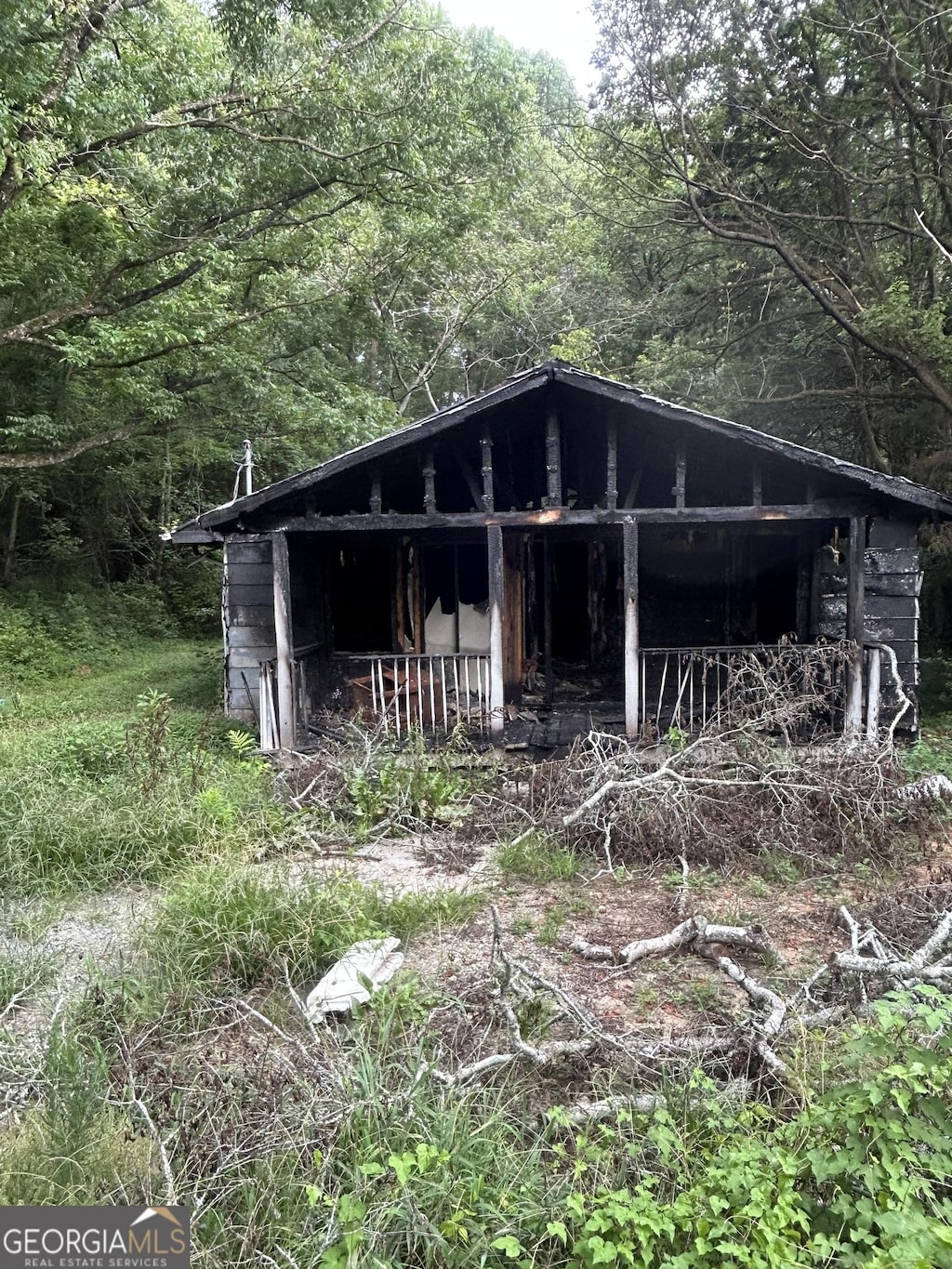 3848 Log Cabin Dr, Macon, GA 31204 - view of outbuilding featuring a wooded view
