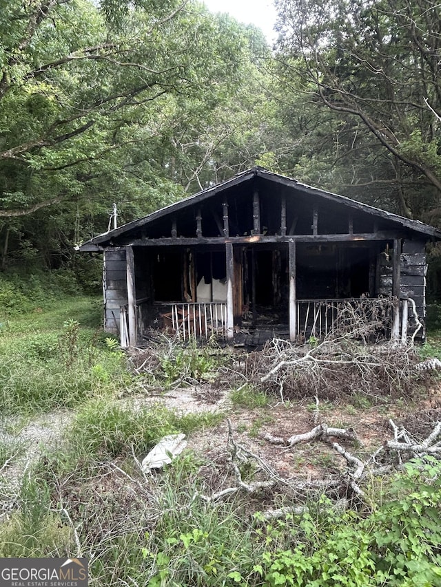 3848 Log Cabin Dr, Macon, GA 31204 - view of outbuilding featuring a wooded view