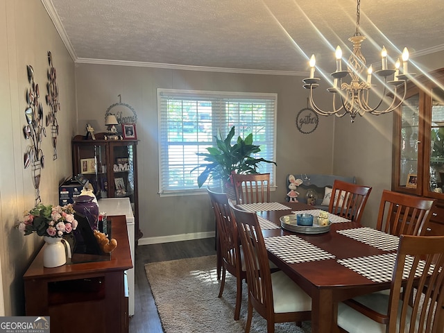 2203 Honeybee Creek Dr, Griffin, GA 30224 - dining area featuring wood finished floors, ornamental molding, a textured ceiling, and a chandelier