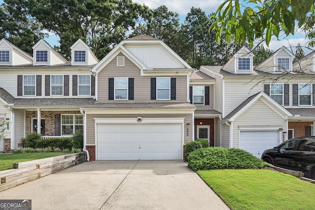 545 Windstone Trl, Alpharetta, GA 30004 - view of property with concrete driveway, a garage, brick siding, and a front lawn