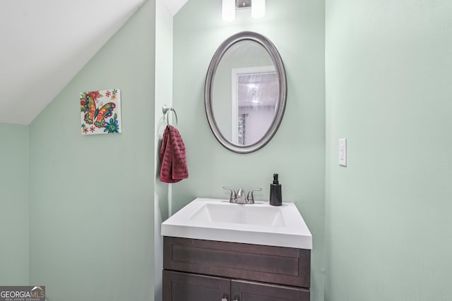 545 Windstone Trl, Alpharetta, GA 30004 - bathroom featuring lofted ceiling and vanity