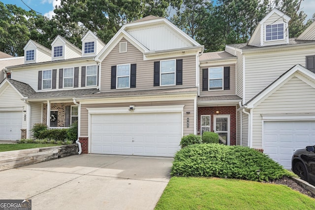 545 Windstone Trl, Alpharetta, GA 30004 - view of front of house with brick siding, driveway, and an attached garage