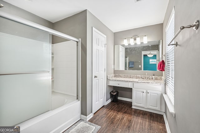 545 Windstone Trl, Alpharetta, GA 30004 - bathroom featuring wood finished floors, vanity, enclosed tub / shower combo, and healthy amount of natural light