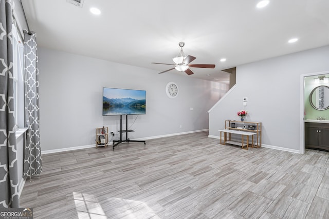 545 Windstone Trl, Alpharetta, GA 30004 - unfurnished living room with ceiling fan, recessed lighting, and light wood finished floors