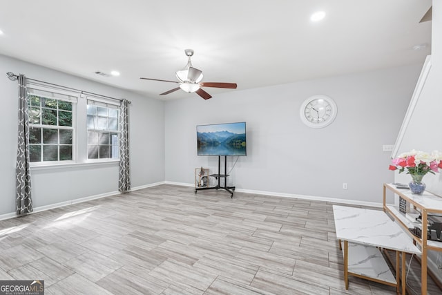 545 Windstone Trl, Alpharetta, GA 30004 - unfurnished living room featuring ceiling fan, recessed lighting, and light wood-style floors