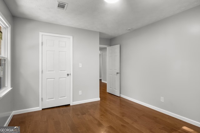 1783 Cheyenne Trl, Jonesboro, GA 30236 - unfurnished bedroom with wood finished floors and multiple windows