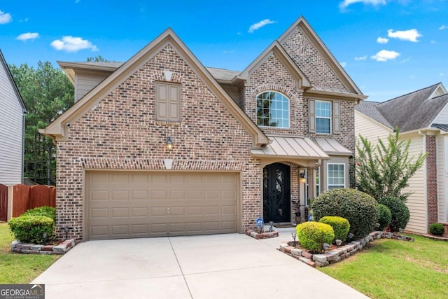 1146 Simonton Peak Way, Lawrenceville, GA 30045 - traditional-style home with brick siding, concrete driveway, a garage, and a standing seam roof