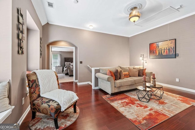 1146 Simonton Peak Way, Lawrenceville, GA 30045 - living area with attic access, arched walkways, wood finished floors, ornamental molding, and a ceiling fan