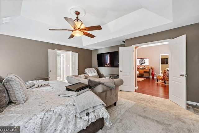 1146 Simonton Peak Way, Lawrenceville, GA 30045 - bedroom featuring carpet flooring, a tray ceiling, and ceiling fan