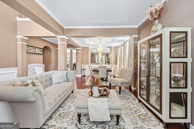 1146 Simonton Peak Way, Lawrenceville, GA 30045 - living room with decorative columns, crown molding, and wood finished floors