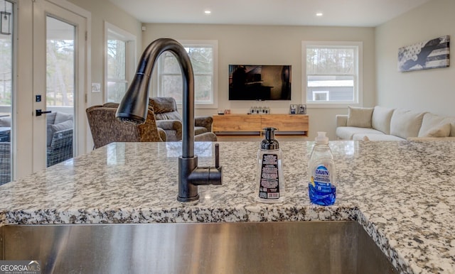480 Mitchell Rd, Covington, GA 30014 - kitchen featuring open floor plan, light stone counters, and recessed lighting