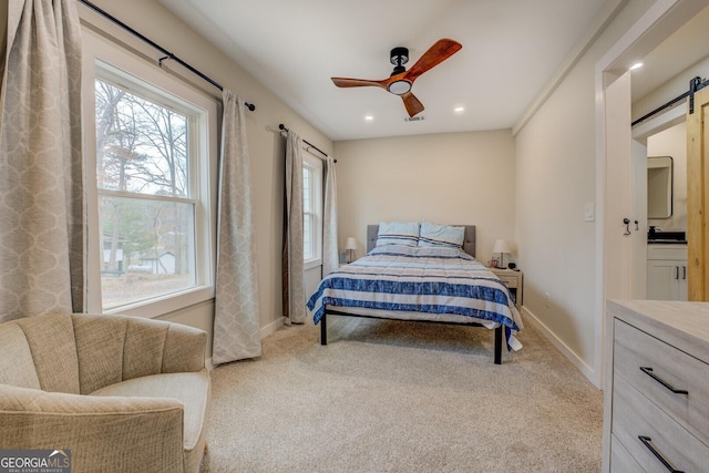 480 Mitchell Rd, Covington, GA 30014 - carpeted bedroom with a barn door, recessed lighting, and ceiling fan