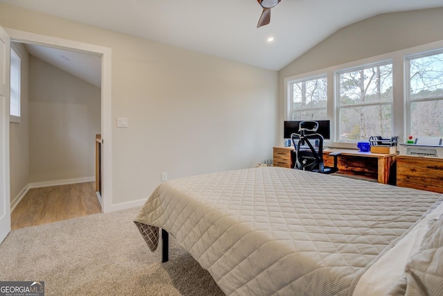 480 Mitchell Rd, Covington, GA 30014 - carpeted bedroom featuring lofted ceiling, multiple windows, recessed lighting, ceiling fan, and wood finished floors