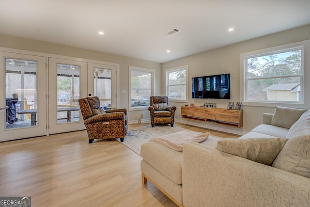 480 Mitchell Rd, Covington, GA 30014 - living room with light wood-style floors, recessed lighting, and french doors
