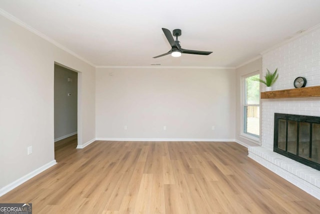 107 Runaway Point Rd, Savannah, GA 31404 - unfurnished living room featuring light wood-style floors, a fireplace, crown molding, and ceiling fan