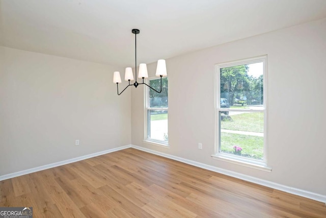 107 Runaway Point Rd, Savannah, GA 31404 - spare room featuring light wood-style floors and a chandelier